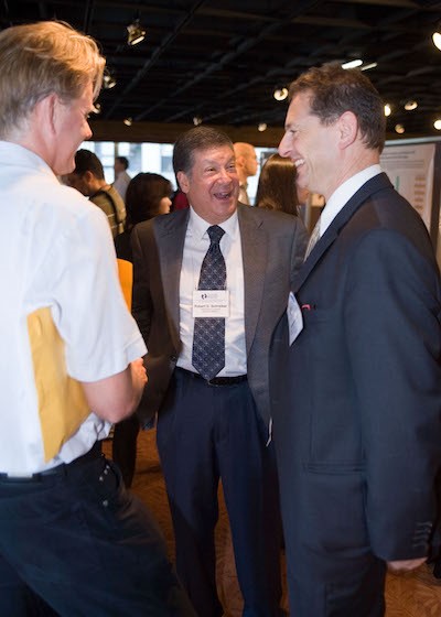 Schreiber, conversing with colleagues Mark J. Smyth, Ph.D., and Jonathan  Cebon, Ph.D., at a CRI Symposium in 2007.